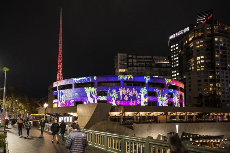 Colourful projection on facade of concert hall.